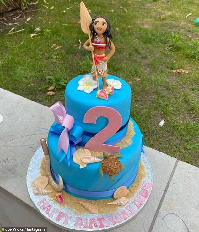 Disney princess: The birthday girl was treated to a lavishly designed Moana cake replete with sand and shells