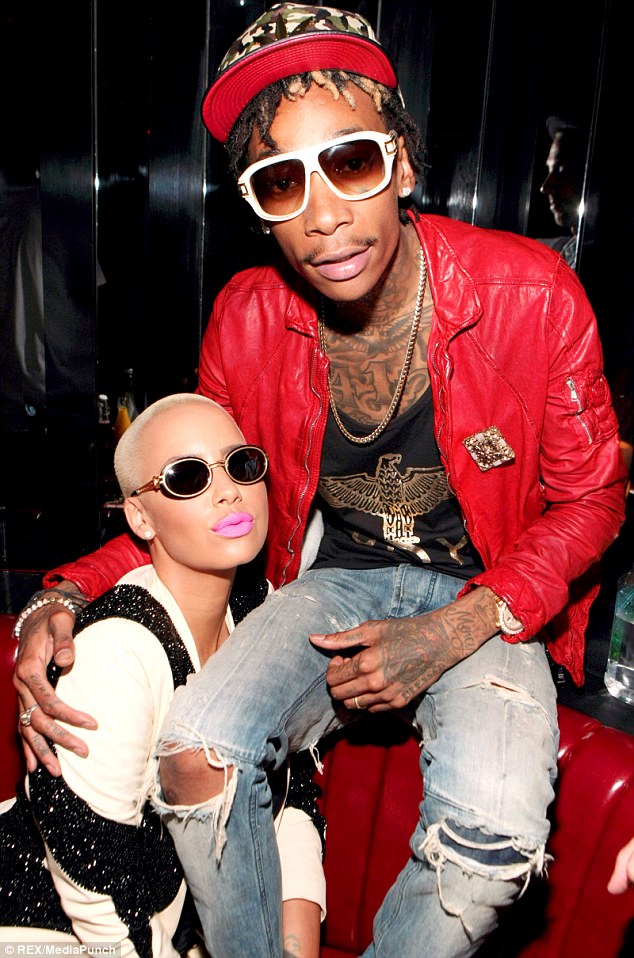 Wedded bliss: Amber Rose and Wiz Khalifa together at the Juicy J Stay Trippy album release party in August just a few days after celebrating their marriage with family and friends