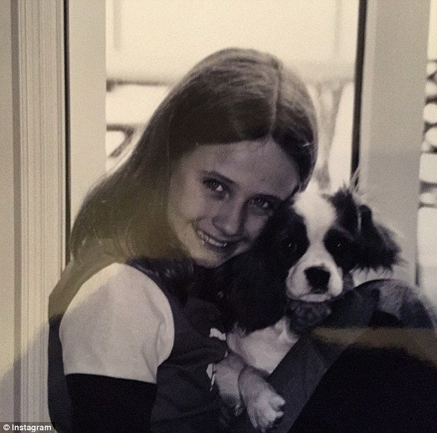 Young love: Tessa James uploaded shot to Instagram showing herself as child holding her beloved dog Bella