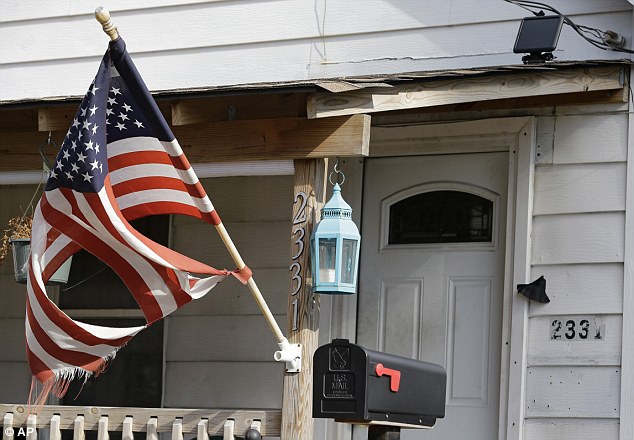 A woman and two other children were living in the same West Cleveland home as Hernandez and his son